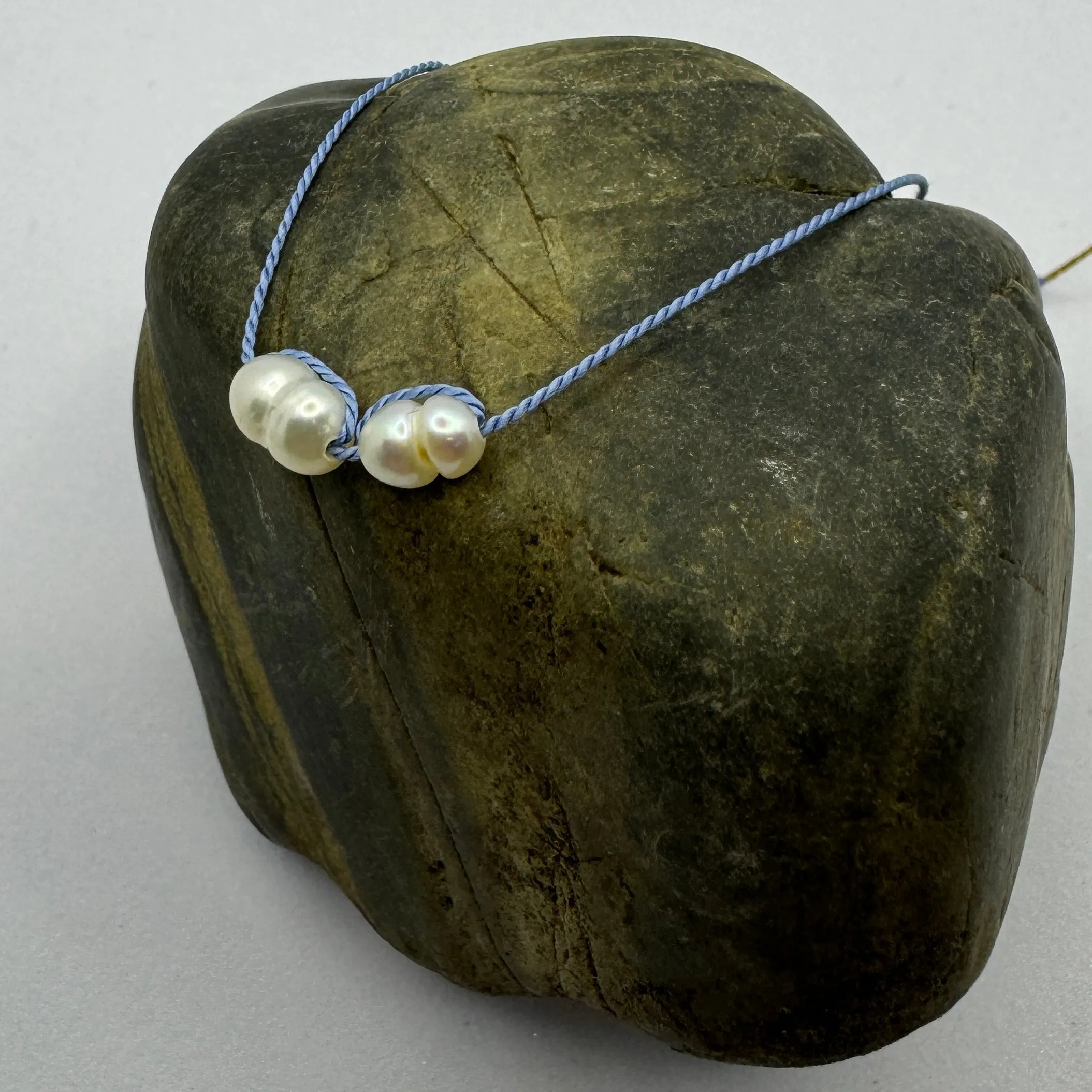 Silk bracelets with pearl charm