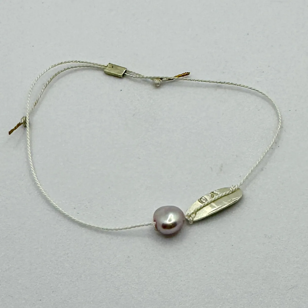 Silk bracelets with pearl charm